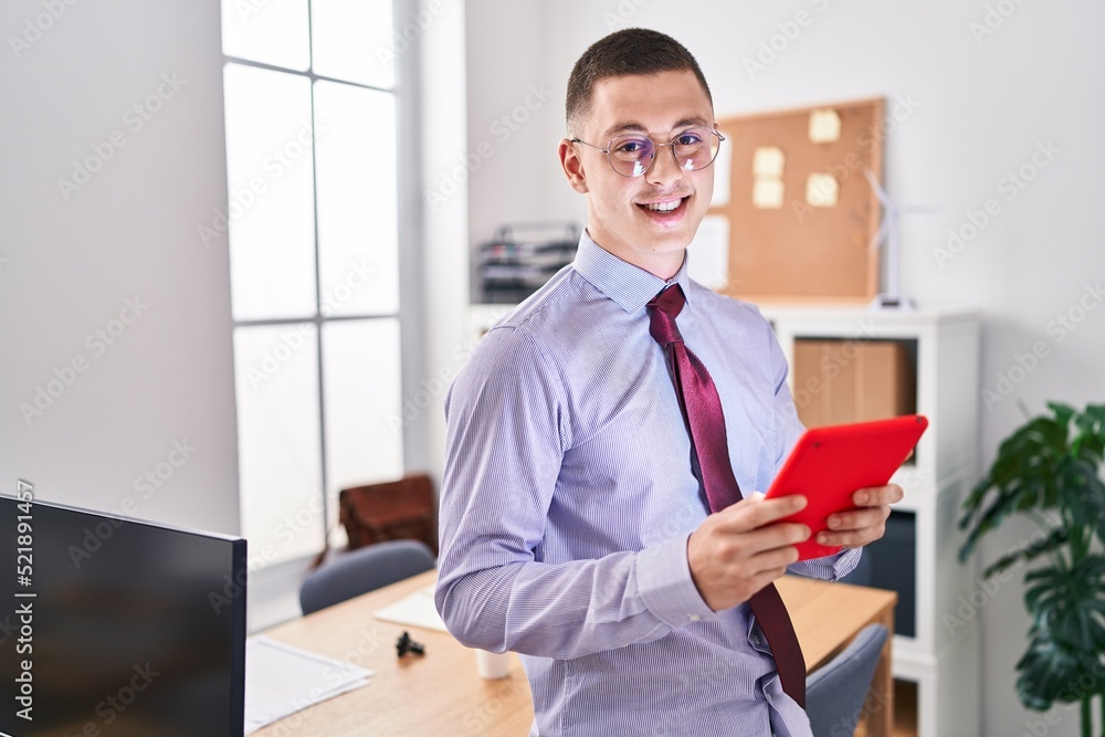 Young hispanic man business worker smiling confident using touchpad at office Young hispanic man business worker smiling confident using touchpad at office