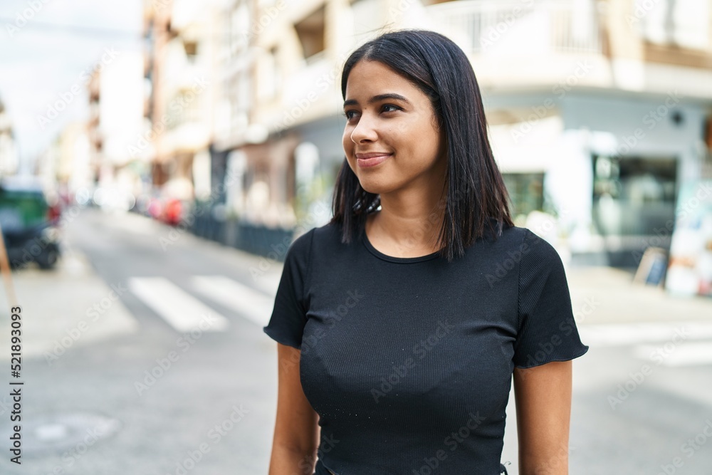 Young latin woman smiling confident standing at street Young latin woman smiling confident standing at street