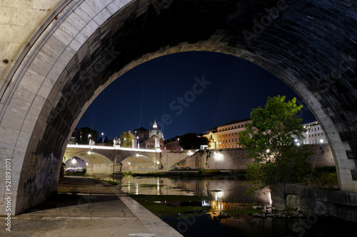 A long exposure of the Tiber river in Rome at night.
