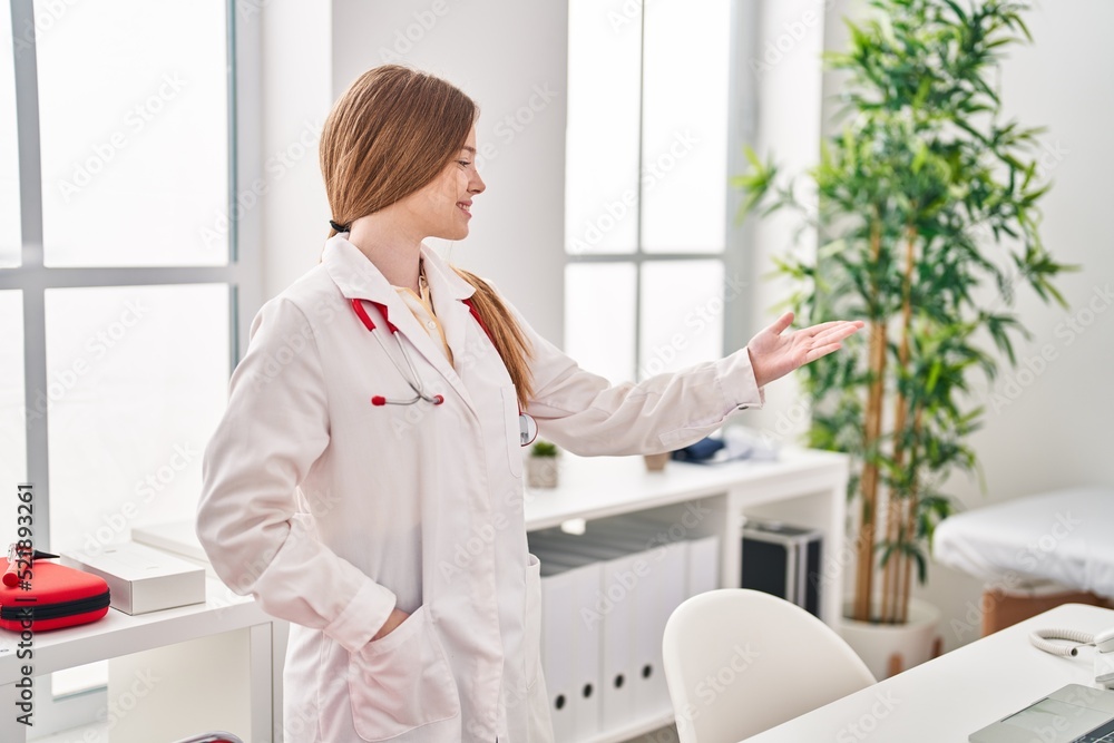 Young blonde woman wearing doctor uniform standing at clinic Young blonde woman wearing doctor uniform standing at clinic