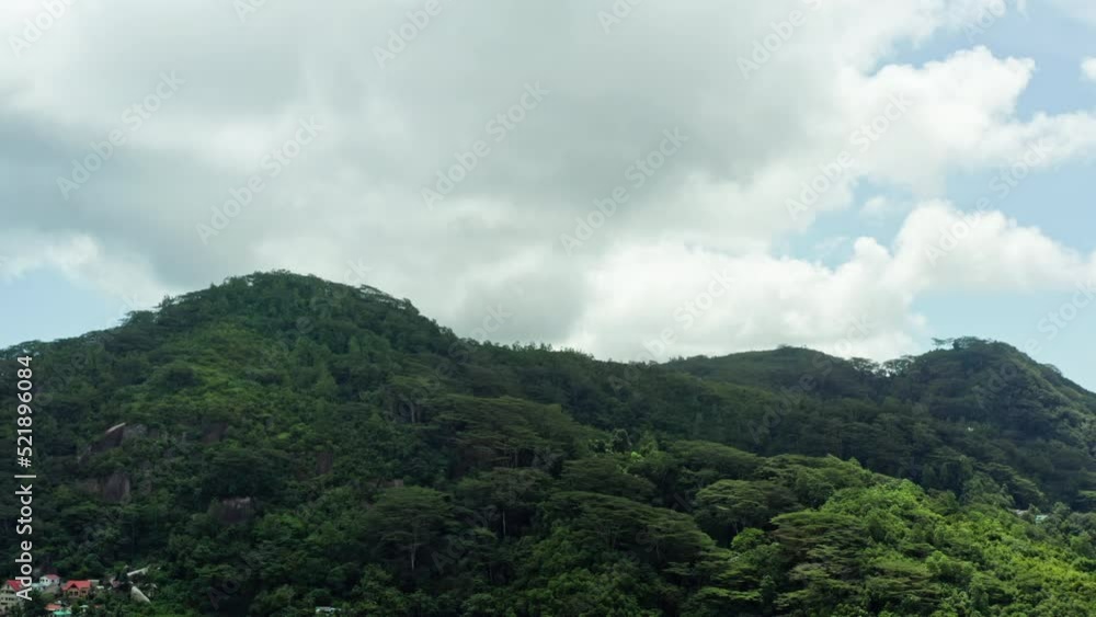 Aerial view of Mahe, Seychelles. Beautiful jungle landscape in the mountains on the island. Trees grow on mountain slopes. High quality 4k footage Aerial view of Mahe, Seychelles. Beautiful jungle landscape in the mountains on the island. Trees grow on mountain slopes. High quality 4k footage