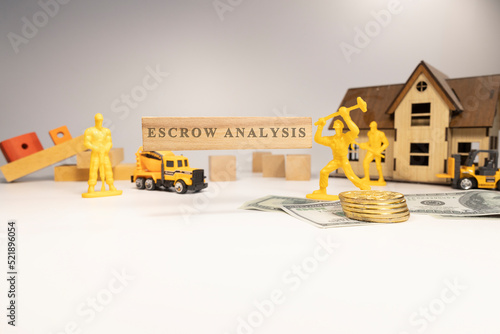 Fotografija Escrow analysis written on wooden surface. economy and business.