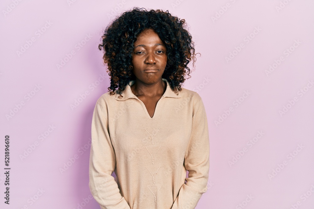 Young african american woman wearing casual clothes depressed and worry for distress, crying angry and afraid. sad expression. Young african american woman wearing casual clothes depressed and worry for distress, crying angry and afraid. sad expression.