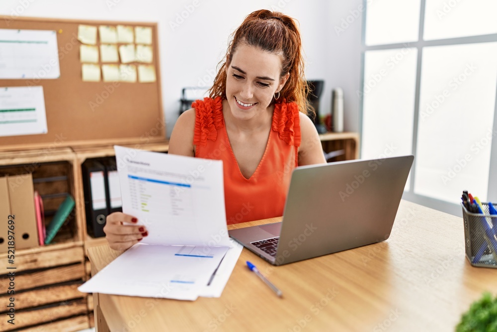 Young redhead woman smiling confident working at office Young redhead woman smiling confident working at office