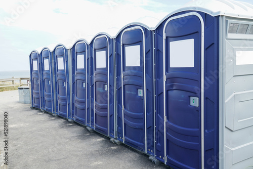 rows of portable toilet outdoor photo