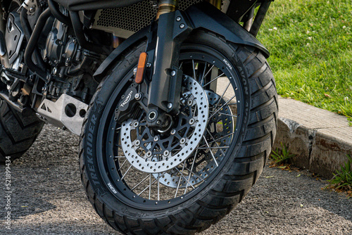 Fototapeta Naklejka Na Ścianę i Meble -  wheel of a black suzuki motorcycle