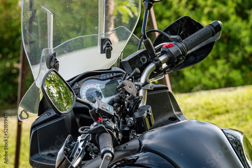 close-up of a black suzuki motorcycle handlebar 
