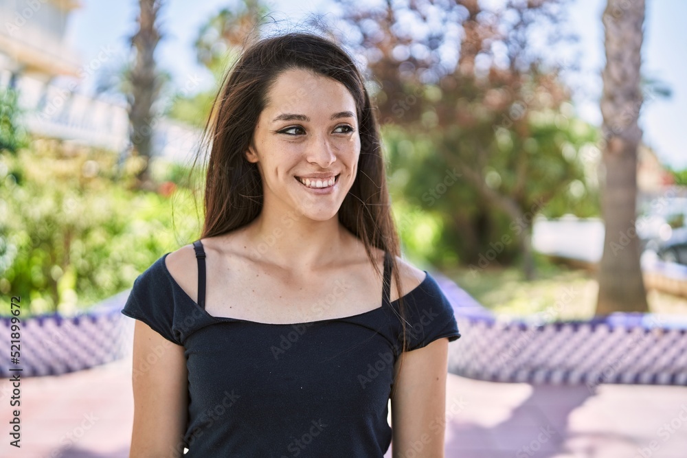 Young hispanic girl smiling happy standing at the city. Young hispanic girl smiling happy standing at the city.