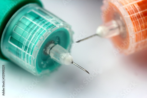 Фотография Close up of hypodermic medical needles used for varius medical drugs
