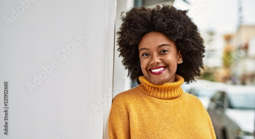 Young african american girl smiling happy standing at the city. © Krakenimages.com