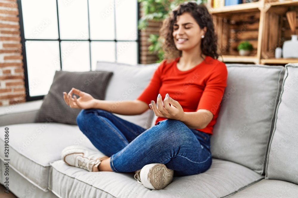 Young latin woman smiling confident doing yoga exercise at home Young latin woman smiling confident doing yoga exercise at home