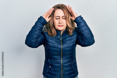 Middle age caucasian woman wearing casual clothes with hand on head for pain in head because stress. suffering migraine.