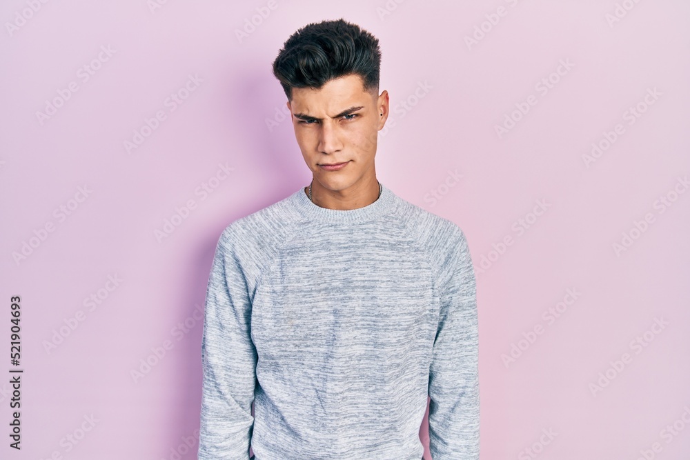 Obraz premium Young hispanic man wearing casual clothes skeptic and nervous, frowning upset because of problem. negative person.