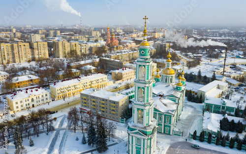 Aerial view of the Spaso-Preobrazhensky Cathedral on the square in the city center and residential buildings in ..Tambov in winter, Russia