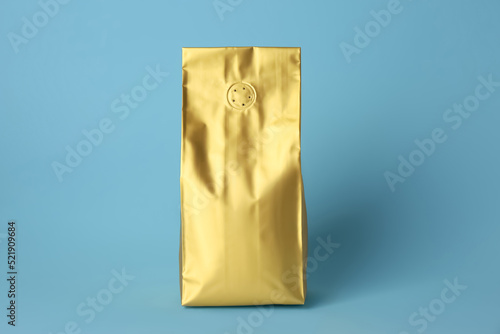 One blank foil package on light blue background