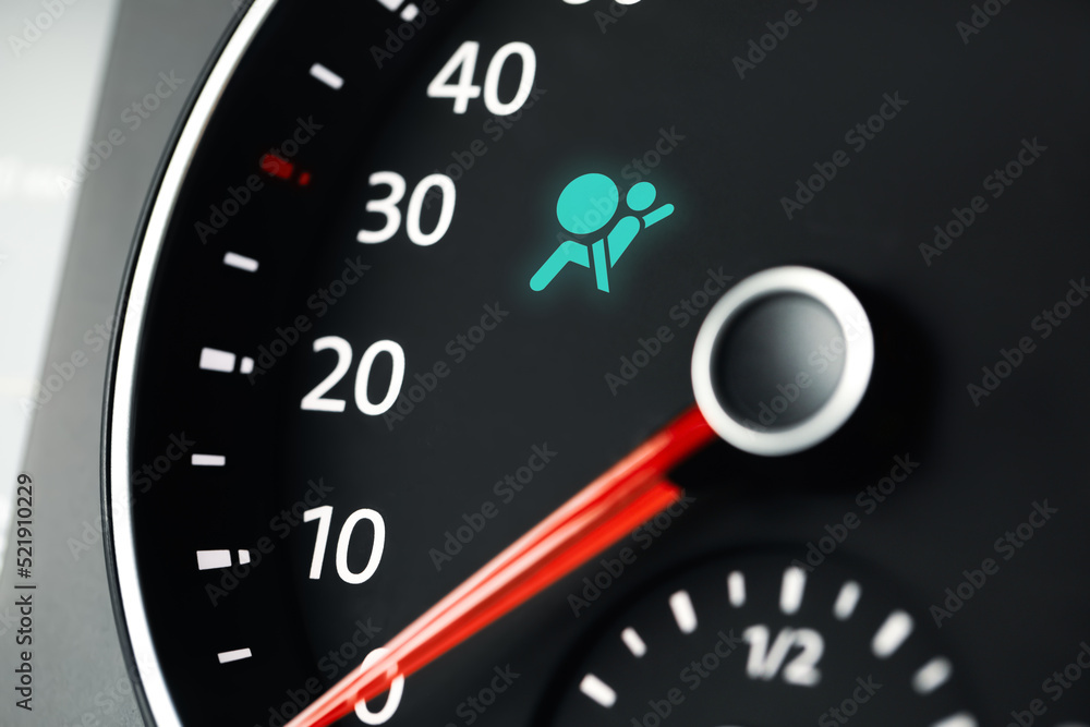 Closeup view of dashboard with warning icon check airbag system in car Closeup view of dashboard with warning icon check airbag system in car