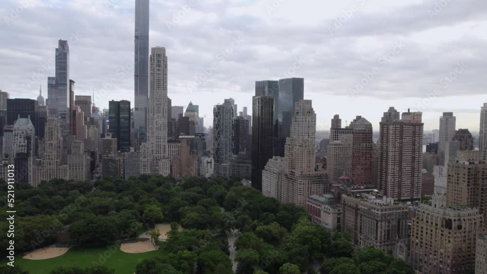 Aerial view over the Central park, towards buildings and the western street in NYC, USA Aerial view over the Central park, towards buildings and the western street in NYC, USA