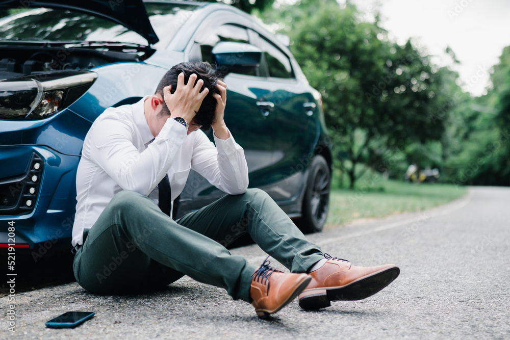 Asian businessman broken car engine breakdown his stressed emotion problem, Accident emergency on the mountain road outdoor late for work concept.