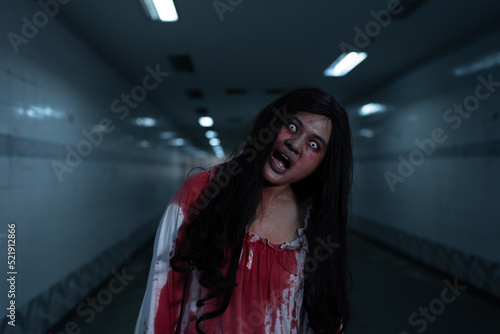 Girl ghost woman death with blood the horror is screaming darkness and nightmare dark background, Scary fear on hell is monster devil in halloween festival.