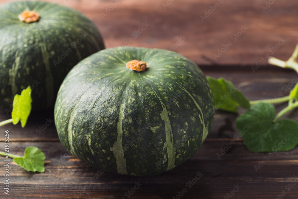 Green pumpkin on wooden background, Organic vegetable Green pumpkin on wooden background, Organic vegetable
