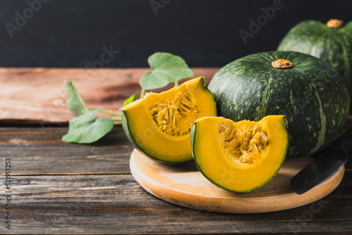 Green pumpkin on wooden background, Organic vegetable photo