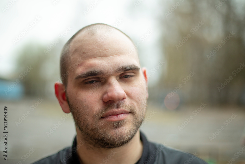 Portrait of guy without hair. Young man with week-long stubble. Portrait of guy without hair. Young man with week-long stubble.