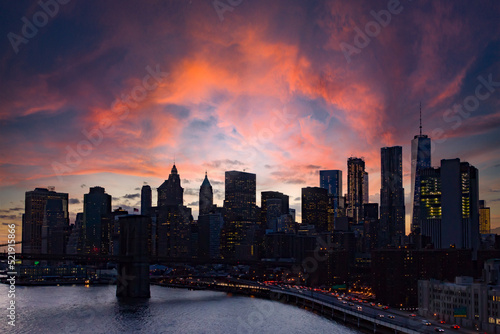Colorful clouds above the buildings of the New York City skyline at night