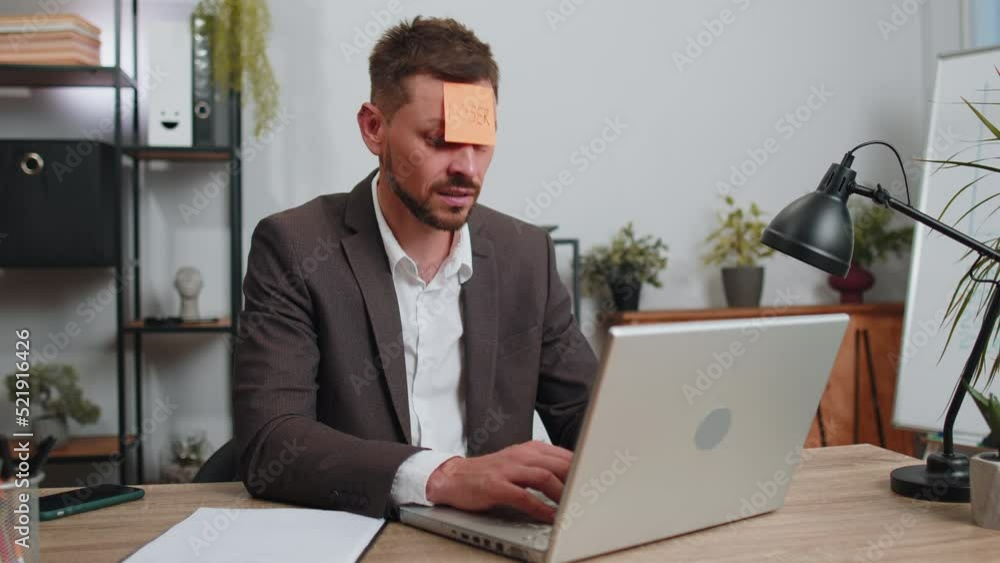 Businessman in suit with inscription note text Loser on forehead working on laptop loses becoming surprised sudden lottery results, bad news, fortune loss, fail at office. Male freelancer business man Businessman in suit with inscription note text Loser on forehead working on laptop loses becoming surprised sudden lottery results, bad news, fortune loss, fail at office. Male freelancer business man