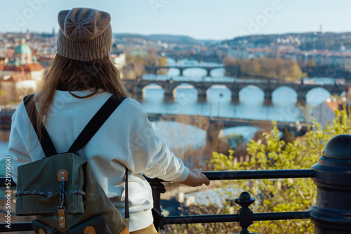 Obraz na plátně trendy woman in sweatshirt in Prague Czech Republic sightseeing