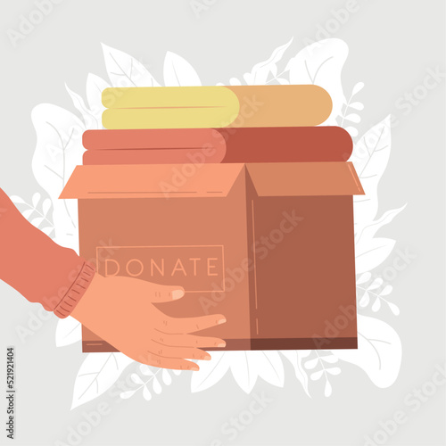 hands lifting donations box