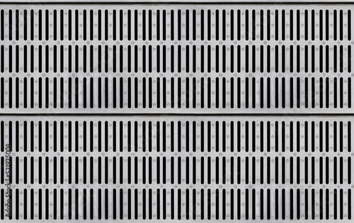 Seamless texture of silver-colored metal grate for water drain with long slits. Top view photo