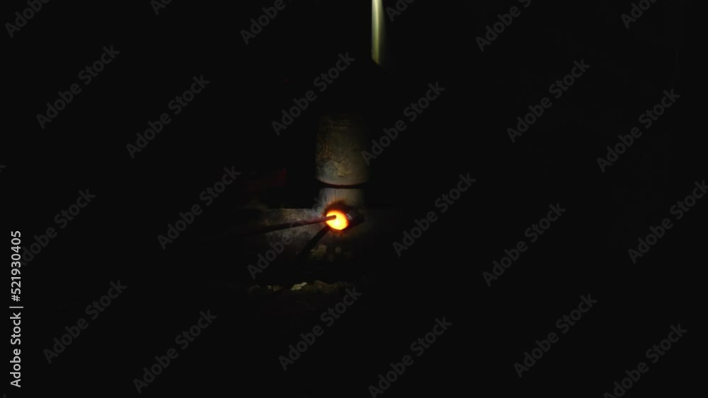 Close-up of electric welder's work in dark room. Bright flames, smoke and sparks. Welder trying to catch the arc with an electrode. Slow motion. The hard manual labor of a specialist Close-up of electric welder's work in dark room. Bright flames, smoke and sparks. Welder trying to catch the arc with an electrode. Slow motion. The hard manual labor of a specialist