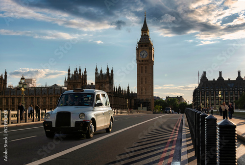 Canvas Print British Taxi running on Westminster Bridge at London on Ma7 27, 2022