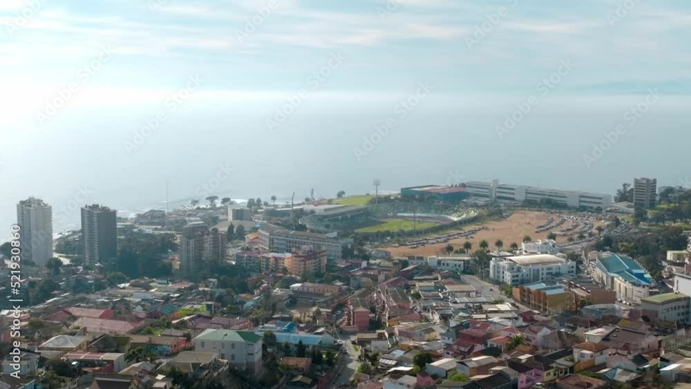 Aerial panoramic view of coastal football stadium surrounded by urban buildings in South America Aerial panoramic view of coastal football stadium surrounded by urban buildings in South America