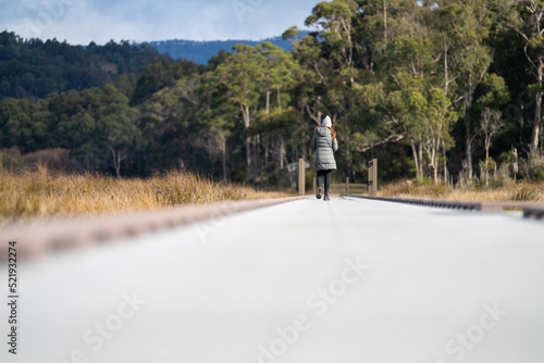 woman walking on a path and track in tasmania australia