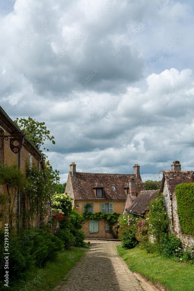 Fototapeta premium One of most beautiful french villages, Gerberoy - small historical village with half-timbered houses and colorful roses flowers, France