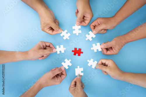 Business concept, Group of business people assembling jigsaw puzzle and represent team support and help togethe