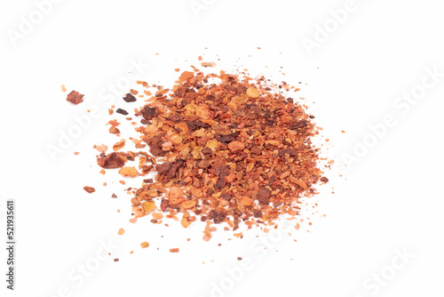 Crushed Red Hot Cayenne peppers. Pile crushed red cayenne pepper, dried chili flakes and seeds isolated on bright background. Close up view.