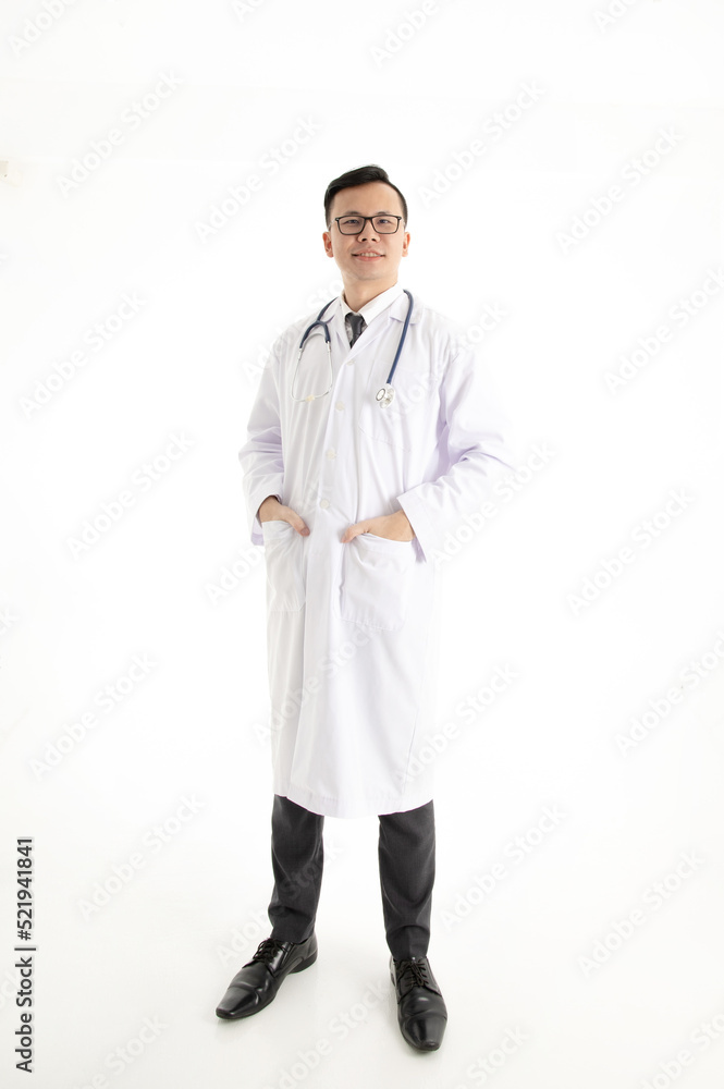 Handsome young Hispanic doctor with stethoscope and a lab coat smiling in a white background Handsome young Hispanic doctor with stethoscope and a lab coat smiling in a white background