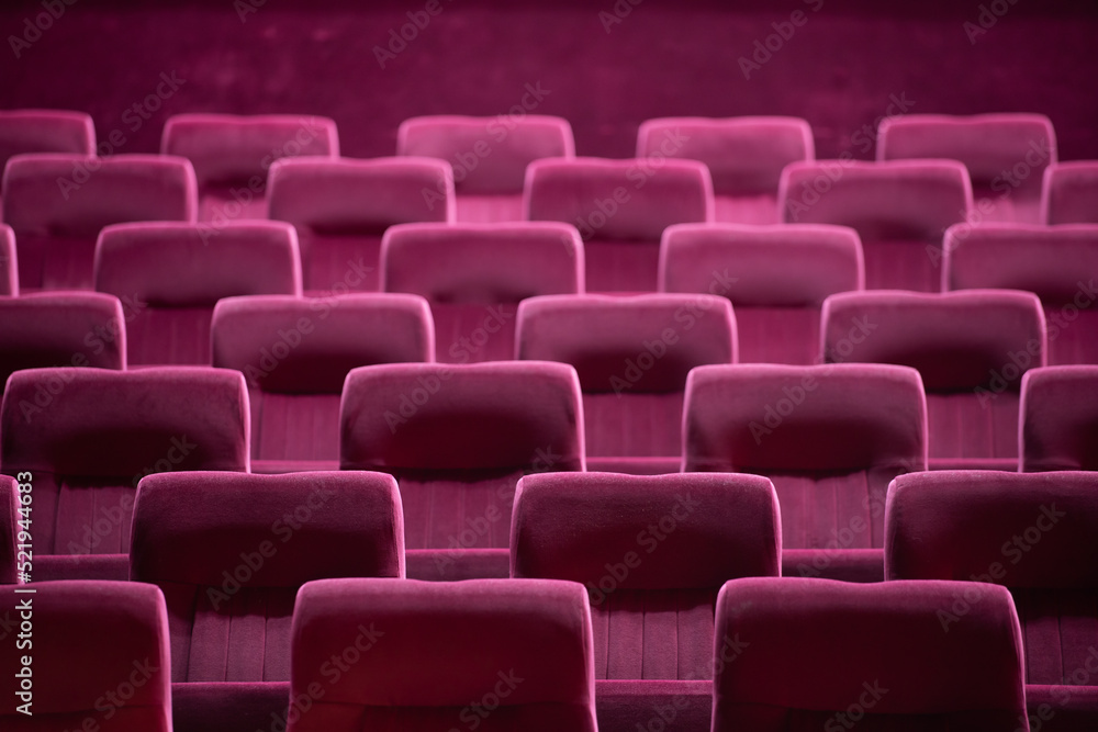 Empty red chairs for audience in the theater Empty red chairs for audience in the theater