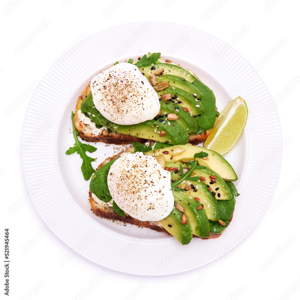 Freshly made poached egg and Avocado toasts isolated on white background Freshly made poached egg and Avocado toasts isolated on white background