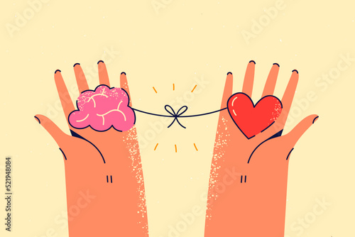 Person holding heart and brain in hands