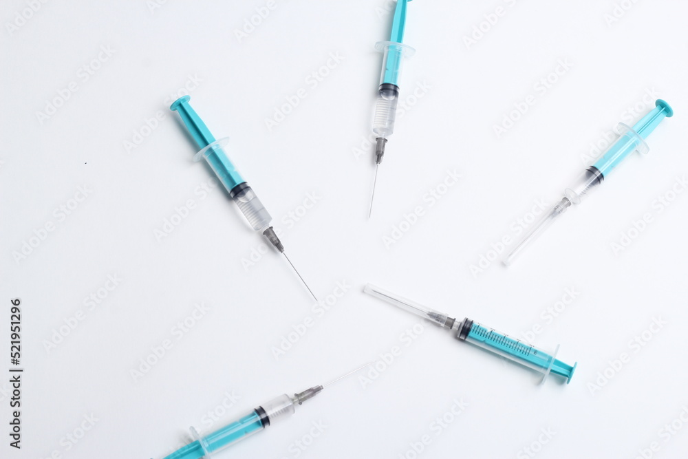 Medical syringe on a white background. A syringe for injection. The concept of health and beauty