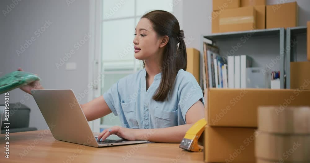 Young asian small business owner packing boxes cardboard boxes for shipping. Young asian small business owner packing boxes cardboard boxes for shipping.