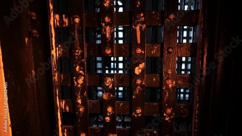 Jail cell door on historic mid 1800s jail cell photo