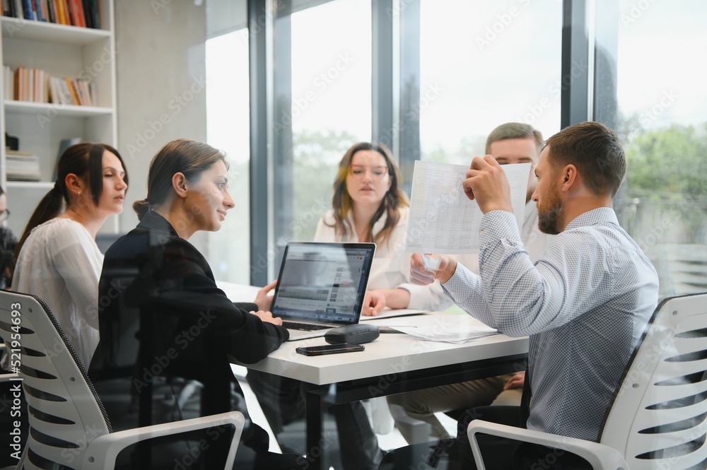 Corporate business team and in a meeting at modern office with big windows . High quality photo Corporate business team and in a meeting at modern office with big windows . High quality photo
