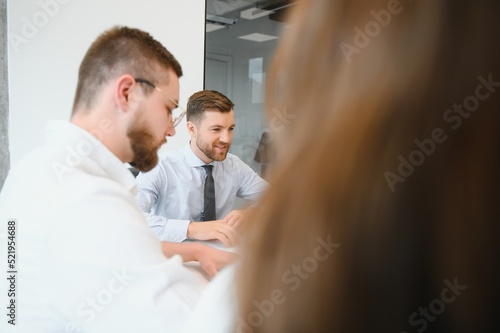 Group of young people in business meeting