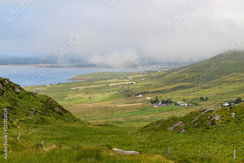 Irish coastline with mountains and low hanging clouds