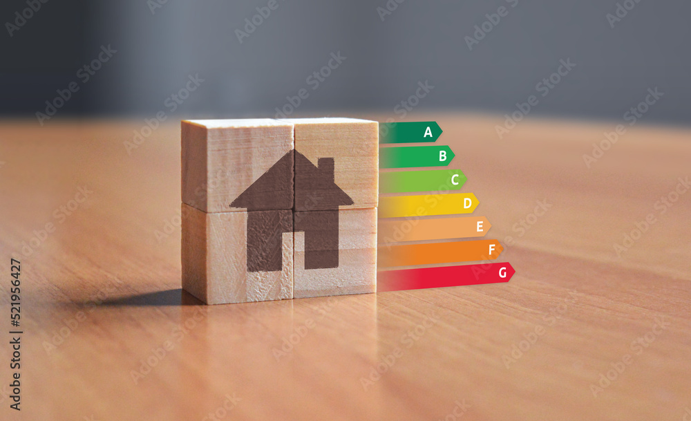 EPC energy performance certificate illustration with wooden blocks displaying a house symbol with energy ratings from A to F - obrazy, fototapety, plakaty 