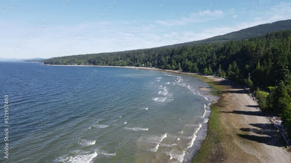 Aerial flyover view of Bonniebrook beach, where temperate rainforests meet the pacific Aerial flyover view of Bonniebrook beach, where temperate rainforests meet the pacific